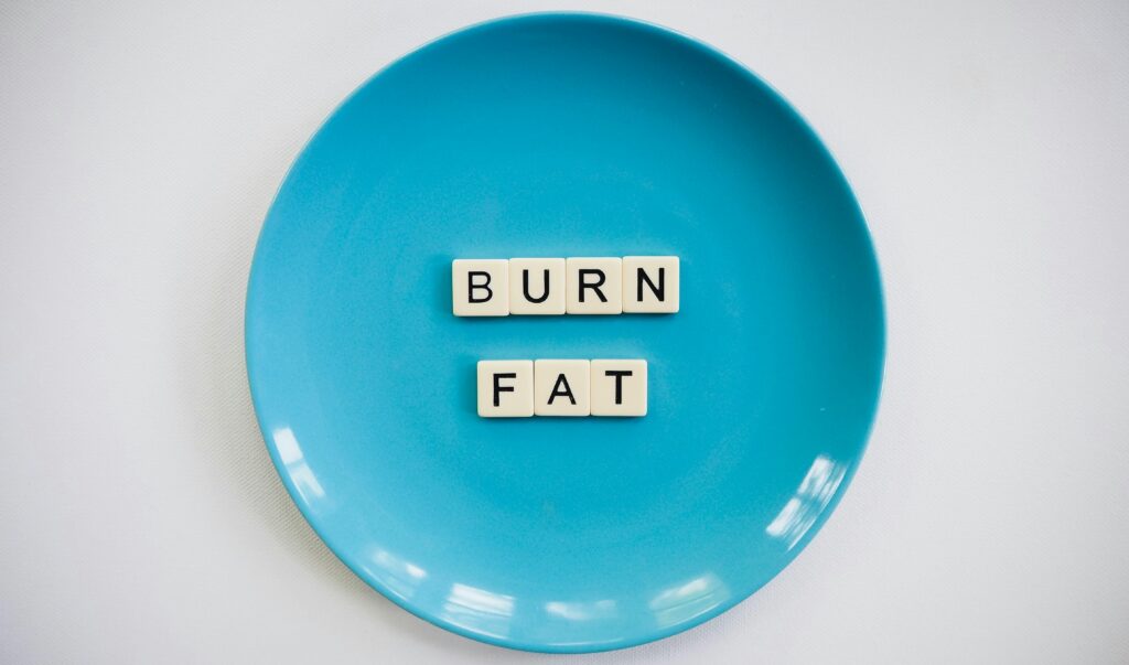 pexels-photo-2383009-2383009 A conceptual image featuring the words 'Burn Fat' on a blue plate, symbolizing weight loss.